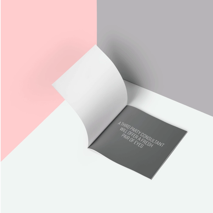 3d mockup of a folded paper on a pink and grey background.