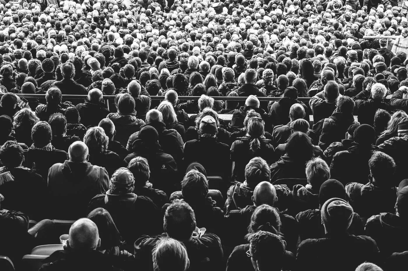 A black and white photo of a crowd at a concert.