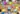 A group of people sitting around a table with social icons.