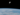 An astronaut is floating in space above the earth.