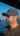 A man wearing sunglasses and a hat on a boat.